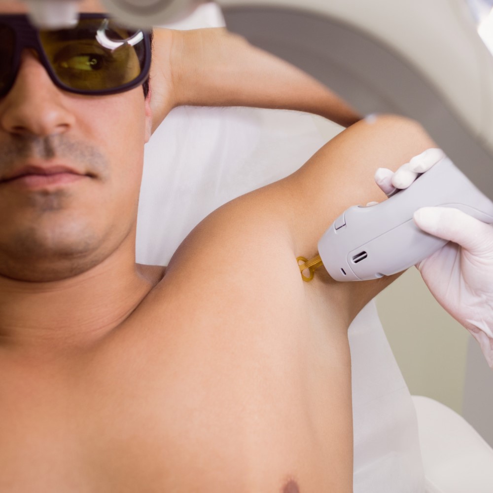 doctor-performing-laser-hair-removal-male-patient-skin